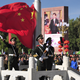 A paramilitary policeman unfurls a Chinese national flag at the celebrations event on Sept. 8.